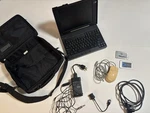 Vintage Ibm Thinkpad 385XD Laptop Computer W/cord & Shown Accessories. Price: $215.00.