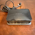 Netgear XAV1004 Powerline Adapter With 4-PORT Ethernet Switch Used. Price: $15.00.